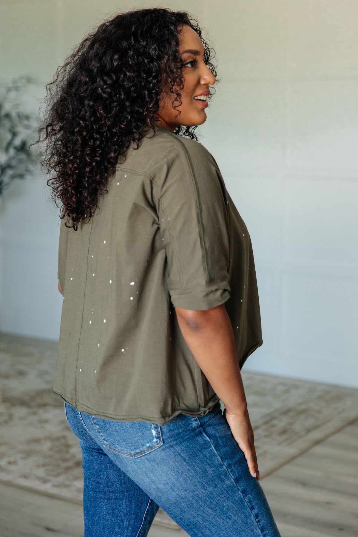 Less Than Stressed Asymmetrical Distressed Top - 5/22/2025