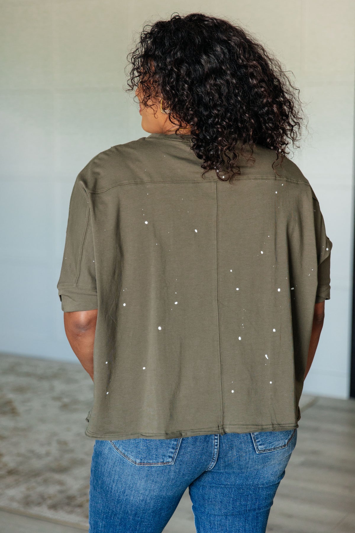 Less Than Stressed Asymmetrical Distressed Top - 5/22/2025