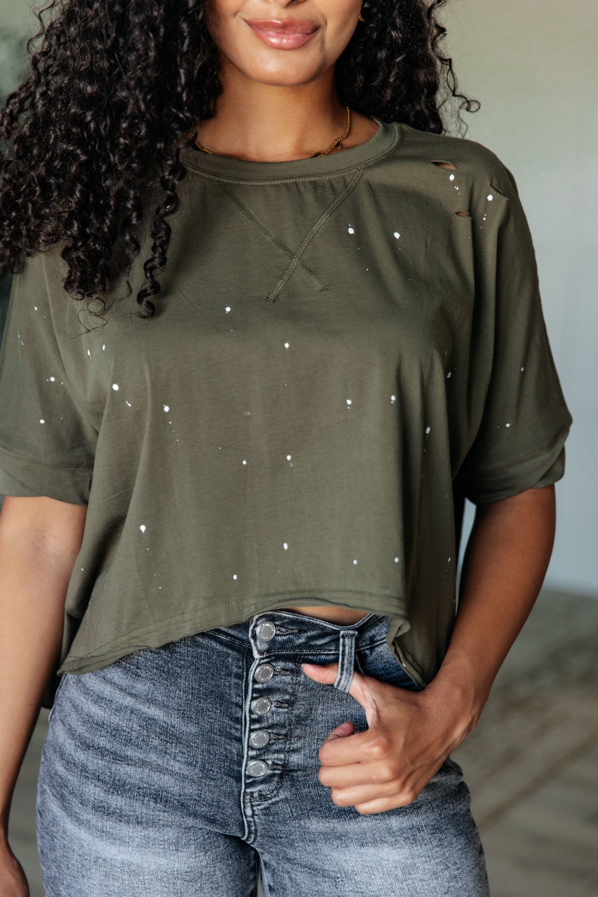 Less Than Stressed Asymmetrical Distressed Top - 5/22/2025