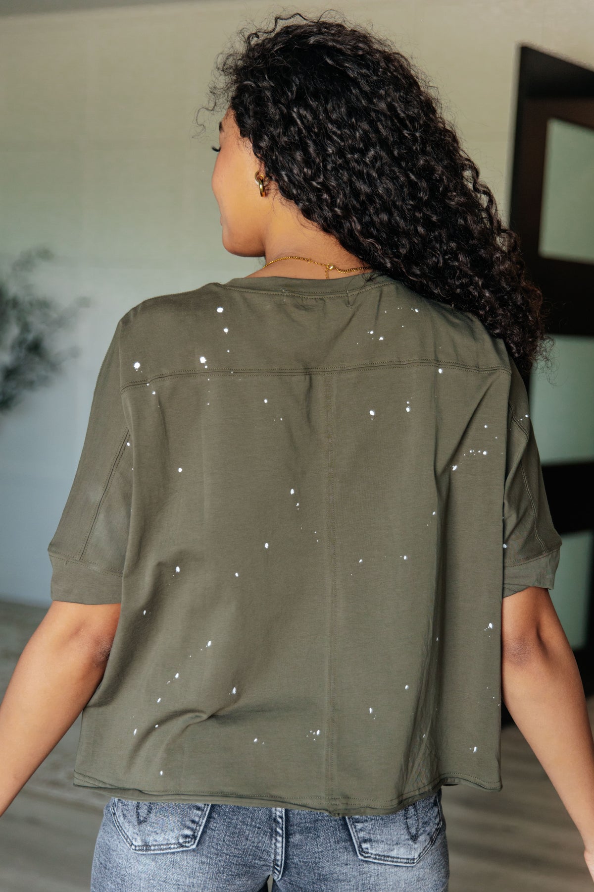 Less Than Stressed Asymmetrical Distressed Top - 5/22/2025