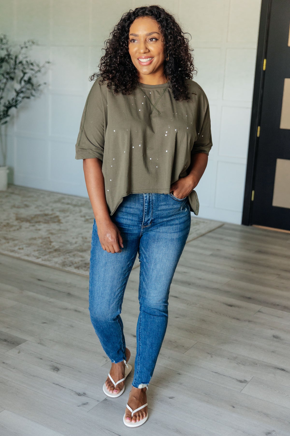 Less Than Stressed Asymmetrical Distressed Top - 5/22/2025