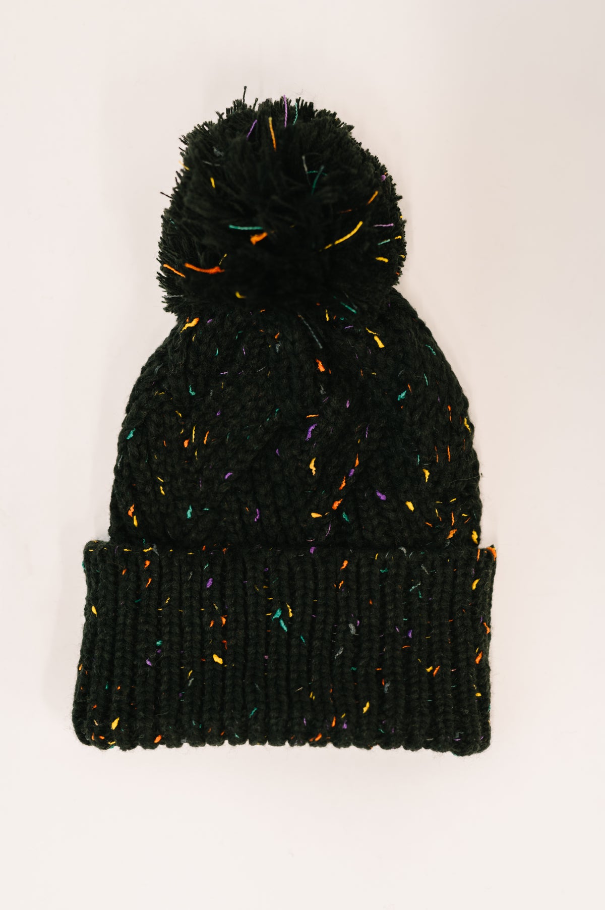Cover Your Ears Pom Pom Beanie in Black - 12/1/2025