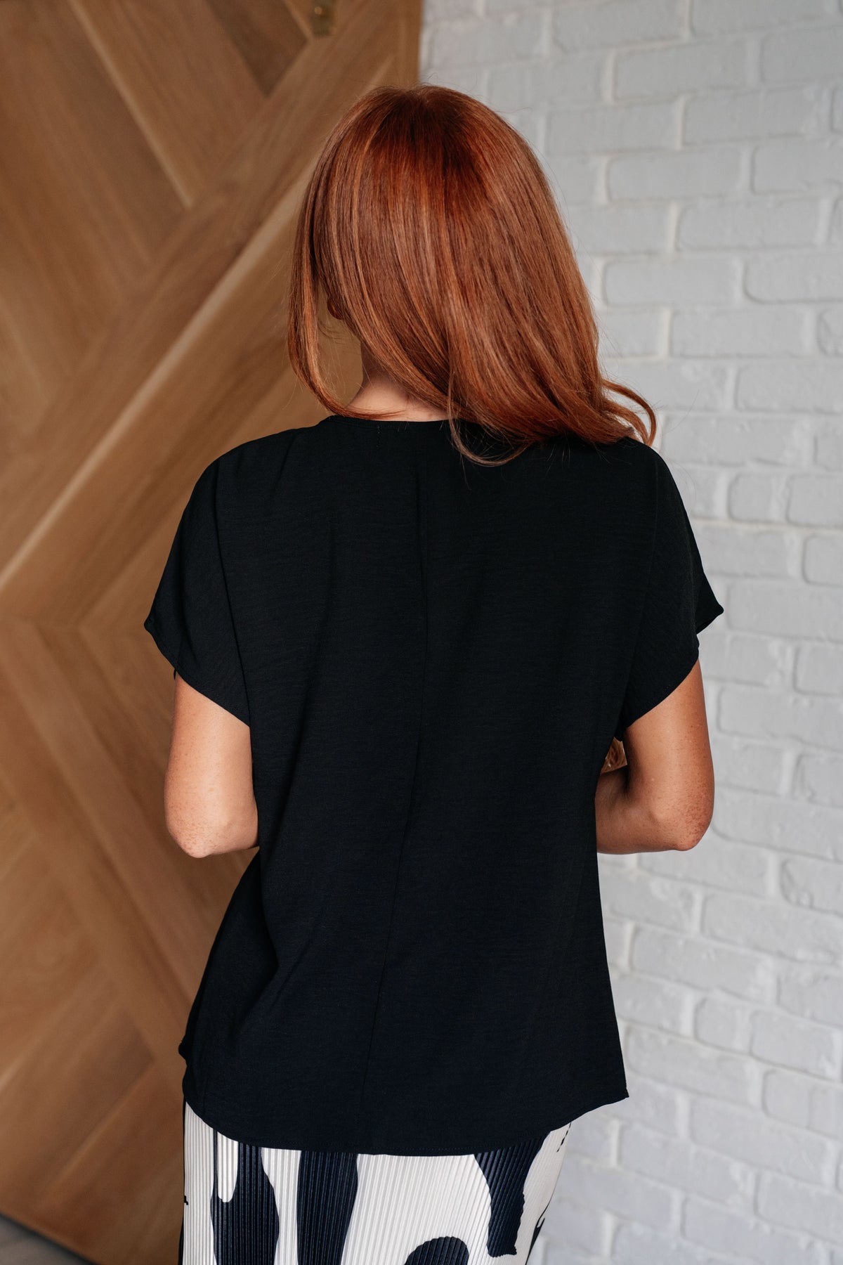 Frequently Asked Questions V-Neck Top in Black - 4/3/2025