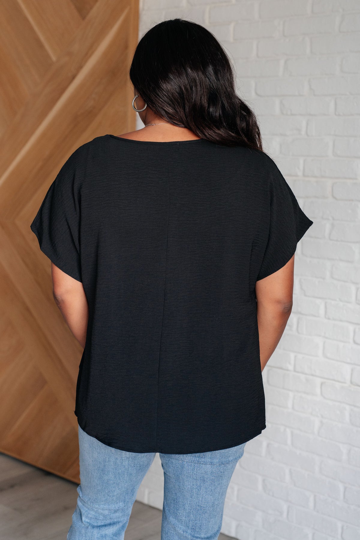 Frequently Asked Questions V-Neck Top in Black - 4/3/2025