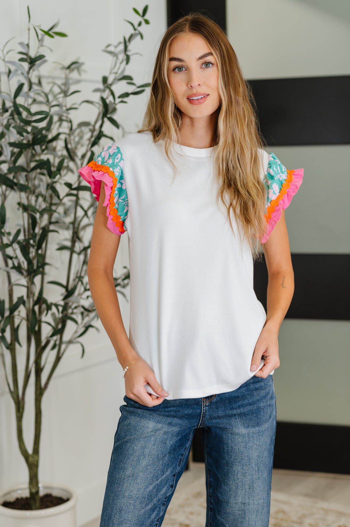 Petals & Poise Floral Flutter Sleeve Top in White - 8/19/2025