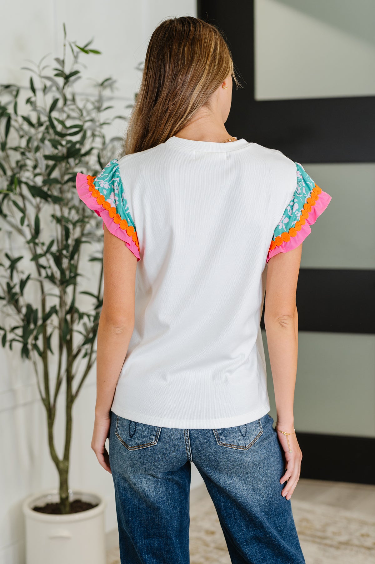 Petals & Poise Floral Flutter Sleeve Top in White - 8/19/2025