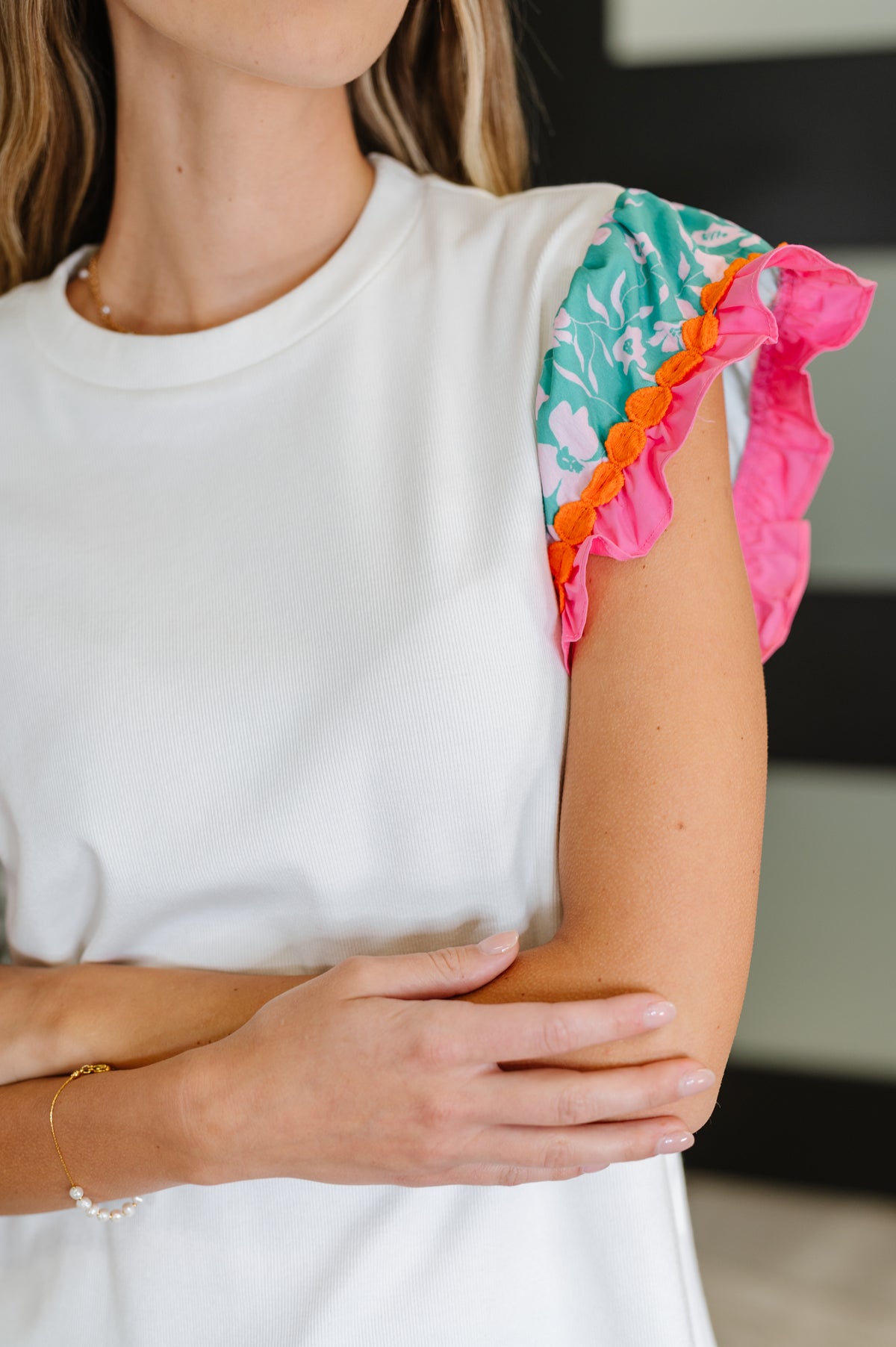Petals & Poise Floral Flutter Sleeve Top in White - 8/19/2025