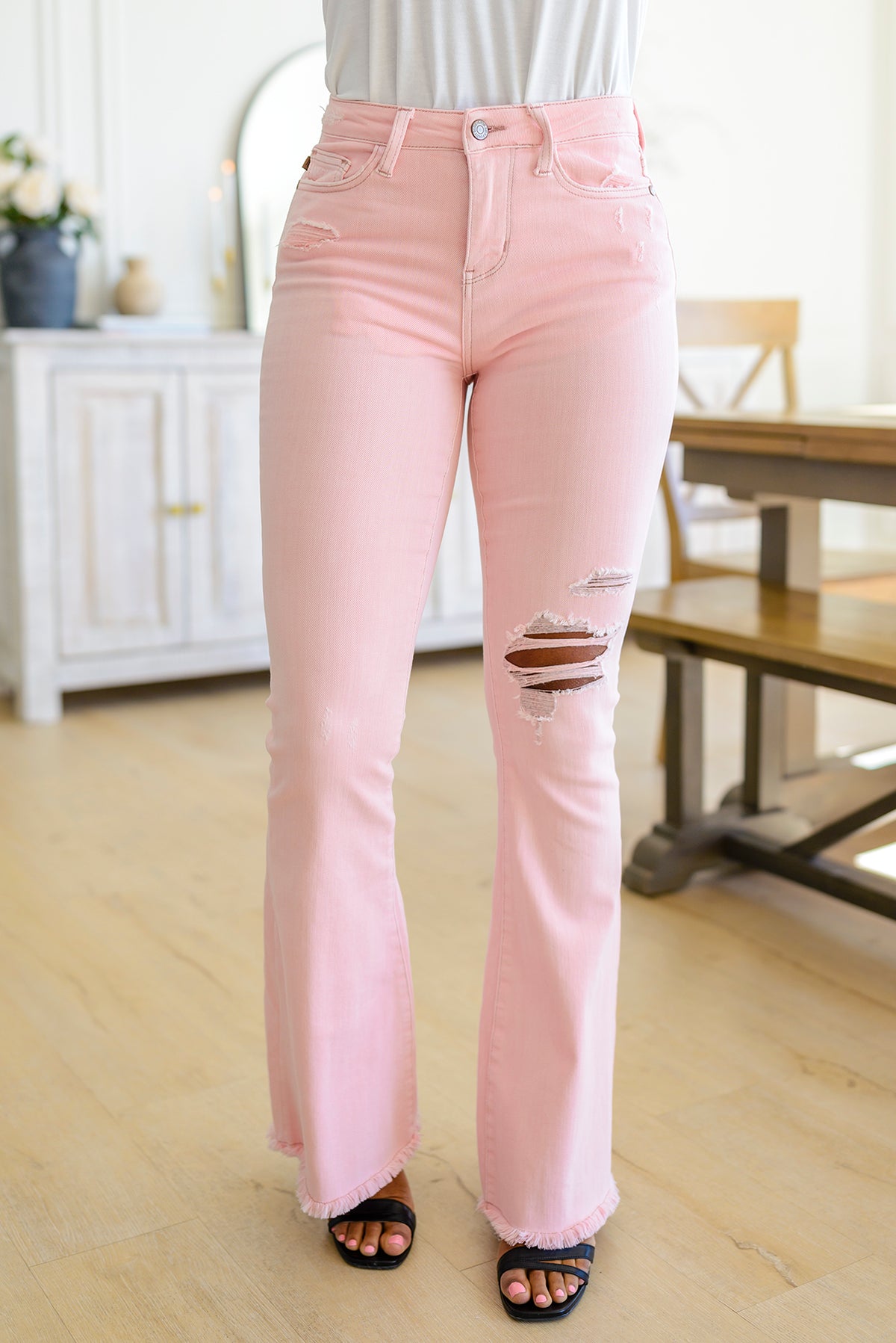 Feminine Flair Mid Rise Distressed Flares in Pastel Pink - 3/7/2023